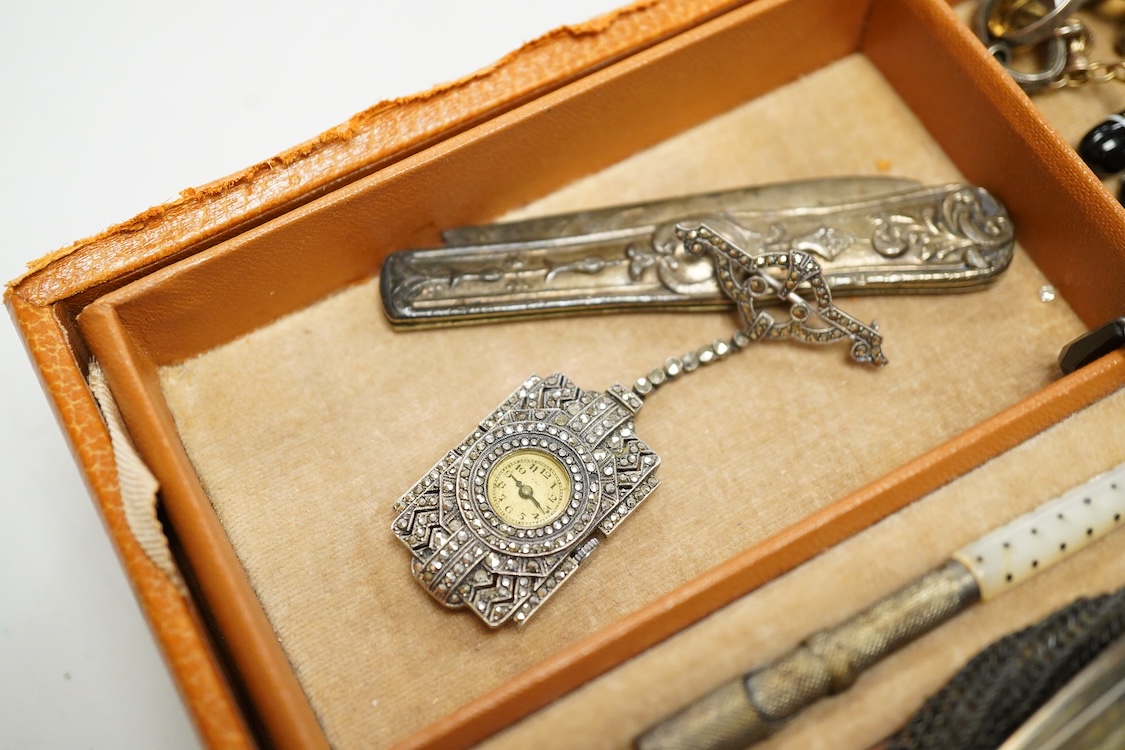 A quantity of assorted antique and later costume jewellery to include a silver and Marcasite ladies fob watch, a collection of cufflinks, brooches and a pair of drop earrings with screw backs